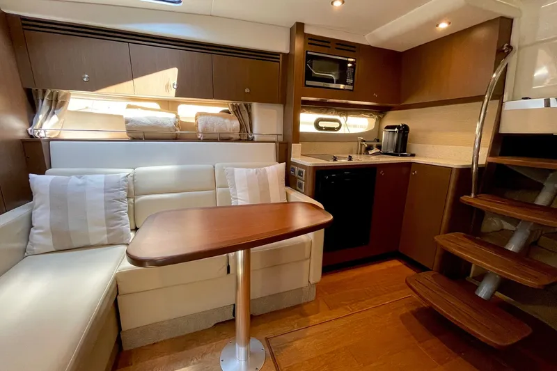 Slide: The Image of Luxurious interior of 2015 Sea Ray Sundancer 350 yacht with kitchen and seating area. - 23