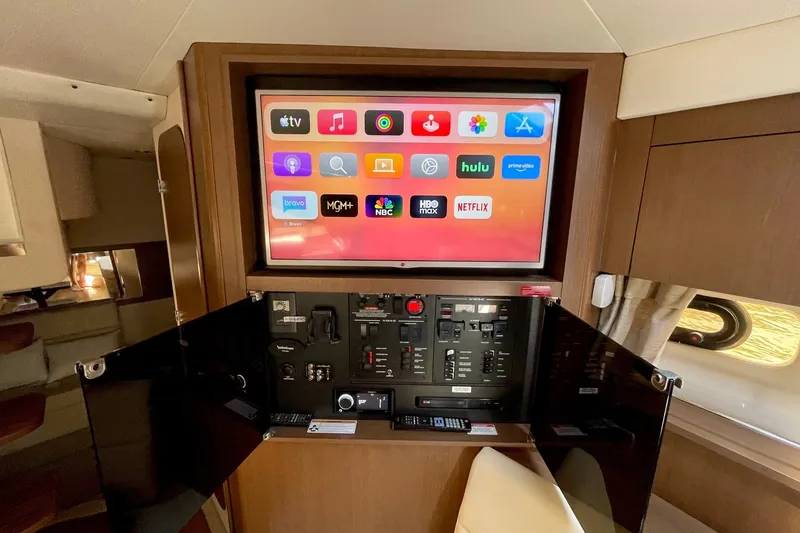 Slide: The Image of Interior of 2015 Sea Ray Sundancer 350 with entertainment system and control panel. - 30