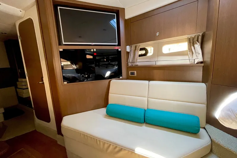 Slide: The Image of Interior of 2015 Sea Ray Sundancer 350 yacht with sofa and mounted TV. - 20