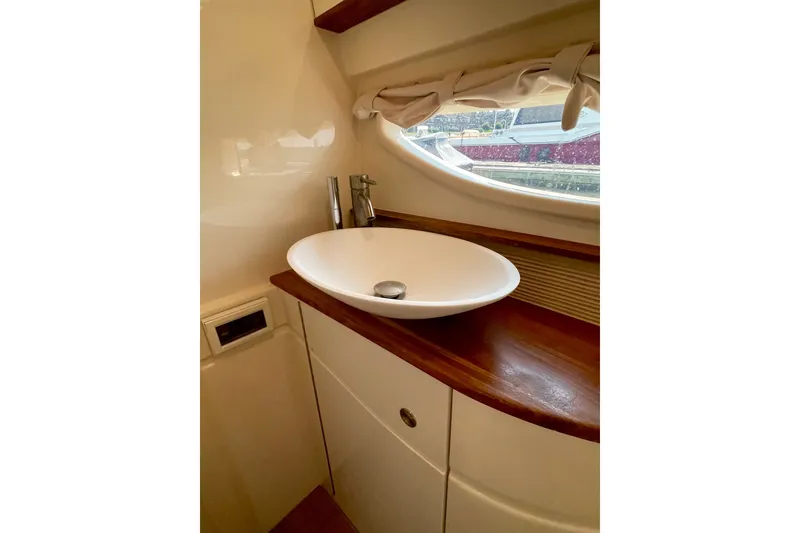 Slide: The Image of Luxurious bathroom interior of 2015 Sea Ray Sundancer 350 yacht with elegant sink. - 28
