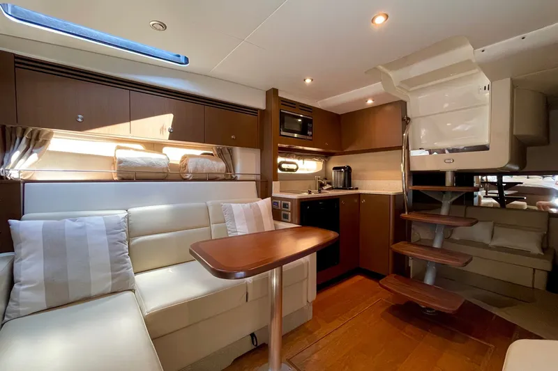 Slide: The Image of Luxurious interior of 2015 Sea Ray Sundancer 350 yacht with modern kitchen and seating area. - 22