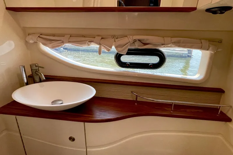 Slide: The Image of Interior of 2015 Sea Ray Sundancer 350 yacht bathroom with sink and window view. - 29
