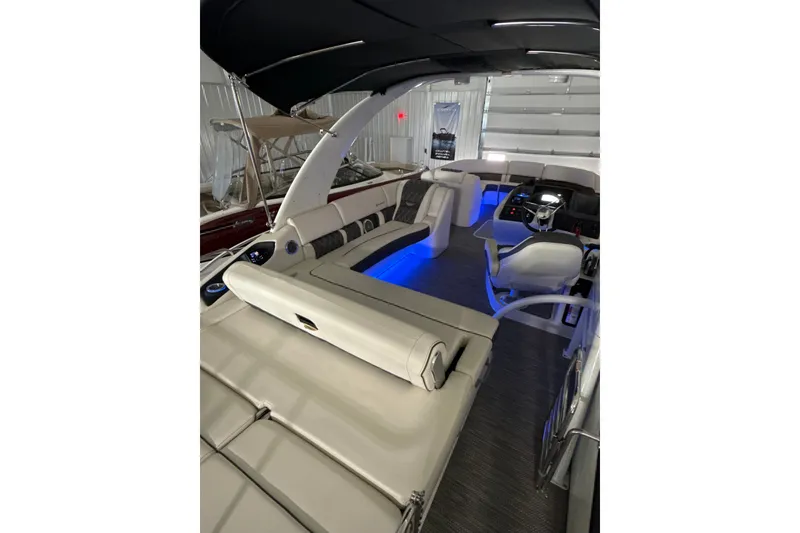 Slide: The Image of Luxurious interior of a 2021 Bennington Q 25 QSBA boat with ambient blue lighting. - 6