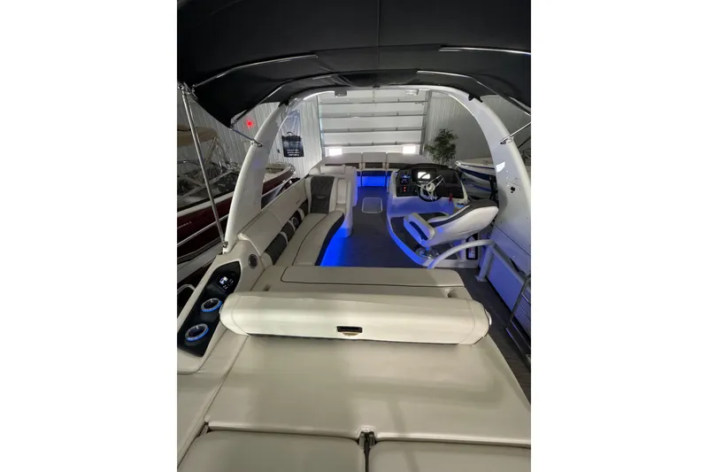 Slide: The Image of Interior of 2021 Bennington Q 25 QSBA boat with modern seating and blue ambient lighting. - 5