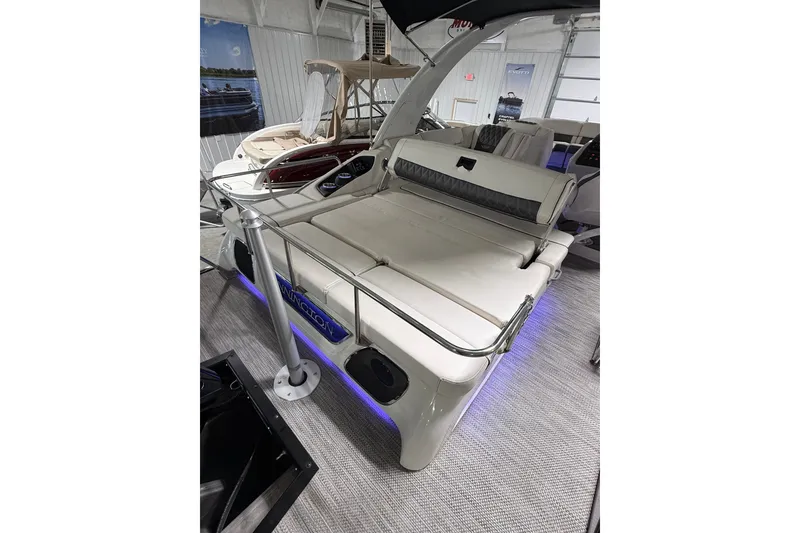 Slide: The Image of 2021 Bennington Q 25 QSBA boat interior with luxurious seating and ambient lighting. - 10
