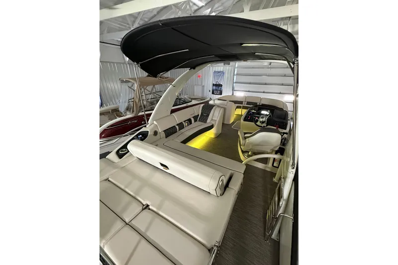 Slide: The Image of 2021 Bennington Q 25 QSBA boat interior with luxurious seating and modern dashboard. - 8