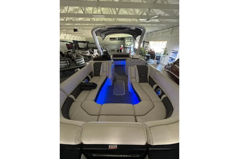 Slide: The Image of 2021 Bennington Q 25 QSBA pontoon boat interior with blue LED lighting. - 7