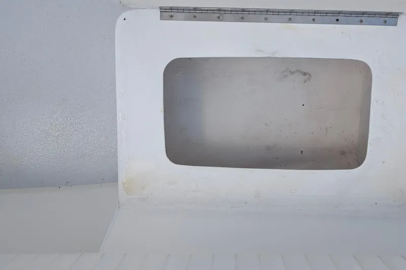 Slide: The Image of Empty storage compartment on a 2012 Gause Built 26 Center Console boat. - 23