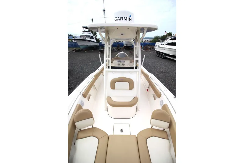 Slide: The Image of 2018 Key West 239 FS boat with Garmin equipment, featuring spacious seating and sleek design. - 16