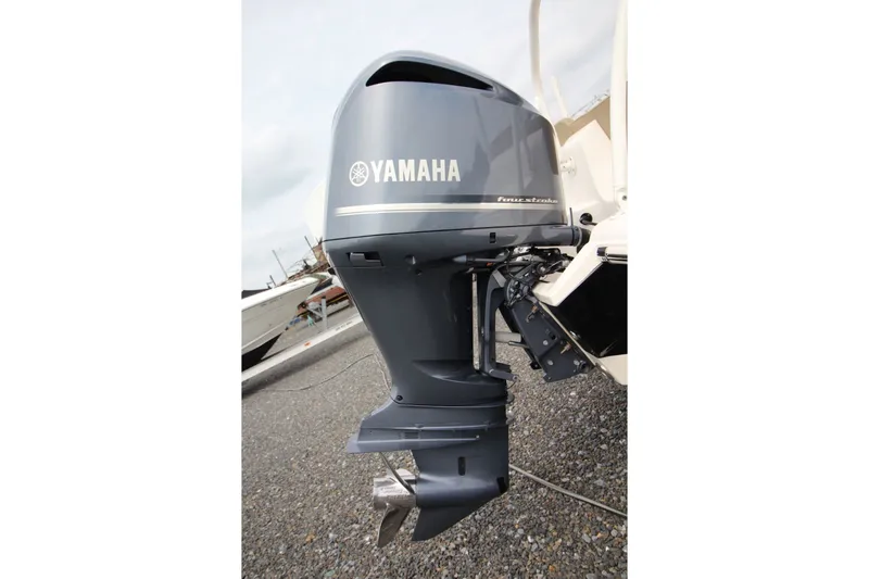 Slide: The Image of Yamaha outboard motor on 2018 Key West 239 FS boat, parked on gravel. - 19