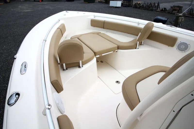 Slide: The Image of 2018 Key West 239 FS boat interior with beige seating and white deck. - 15