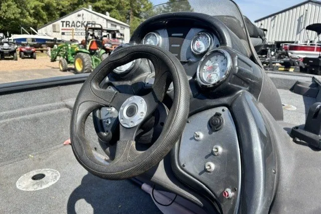 Slide: The Image of 2019 Tracker Pro Team 175 TF boat dashboard with steering wheel and gauges. - 14