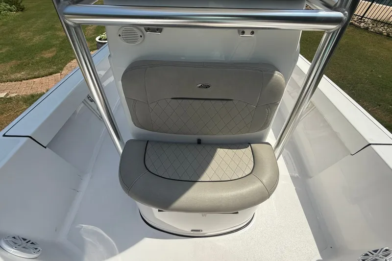 Slide: The Image of 2022 Sportsman Masters 227 Bay Boat seat with stainless steel frame and cushioned backrest. - 14