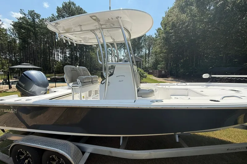 Slide: The Image of 2022 Sportsman Masters 227 Bay Boat on trailer, parked outdoors. - 20