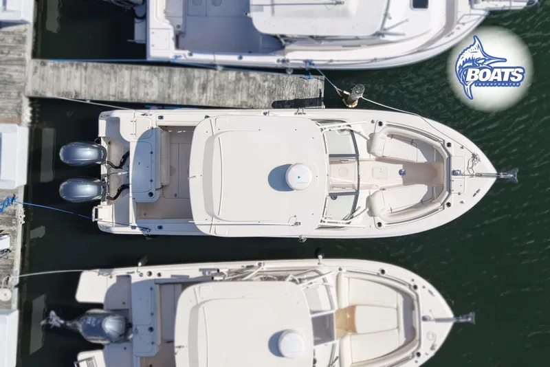 Slide: The Image of Overhead view of a 2015 Grady-White Freedom 275 boat docked at a marina. - 16
