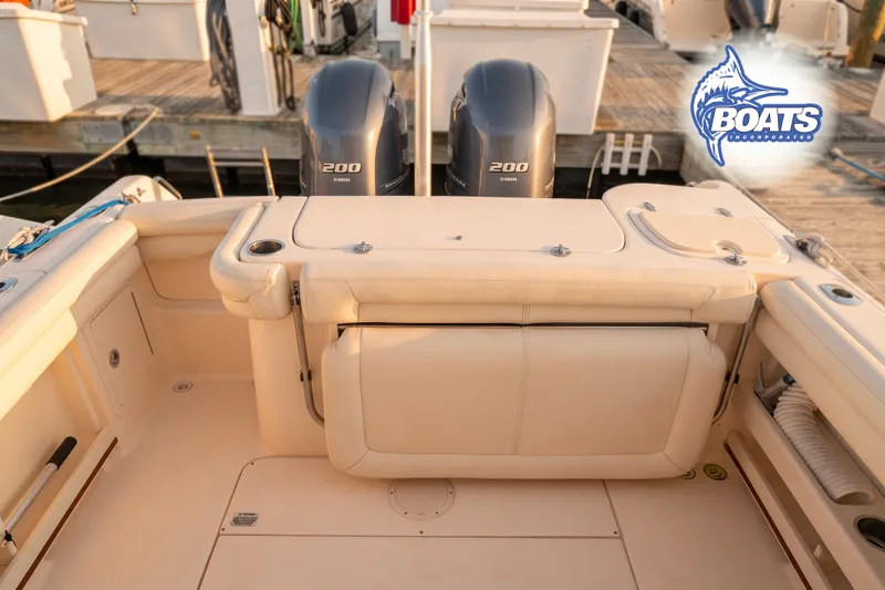 Slide: The Image of 2015 Grady-White Freedom 275 boat interior with Yamaha 200 engines at dock. - 13