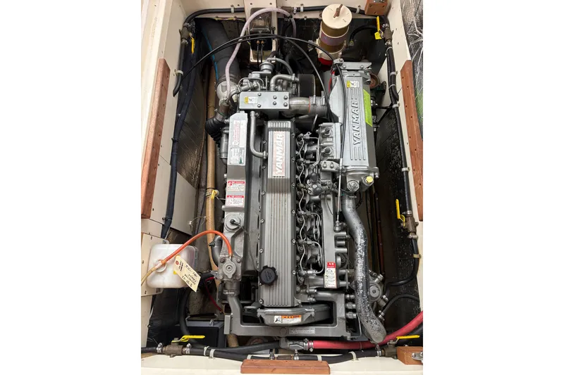 Slide: The Image of Engine compartment of a 2003 Dyer 29 Soft Top boat, featuring a Yanmar engine. - 17