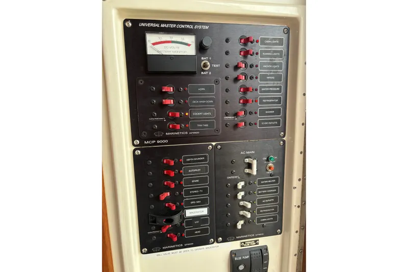 Slide: The Image of Control panel of a 2003 Dyer 29 Soft Top boat with various switches and indicators. - 16