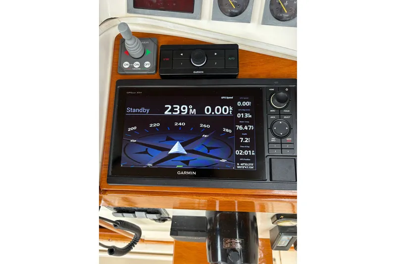 Slide: The Image of Garmin navigation system on 2003 Dyer 29 Soft Top boat dashboard. - 14