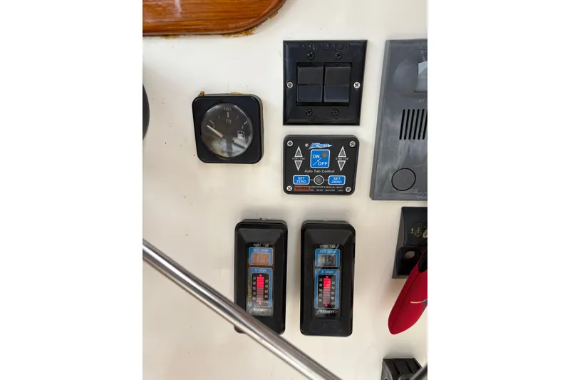Slide: The Image of Control panel of a 2003 Dyer 29 Soft Top boat with gauges and switches. - 15