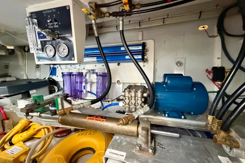 Slide: The Image of Engine room of 2016 Nordic Tug 44 with water filtration system and gauges. - 105