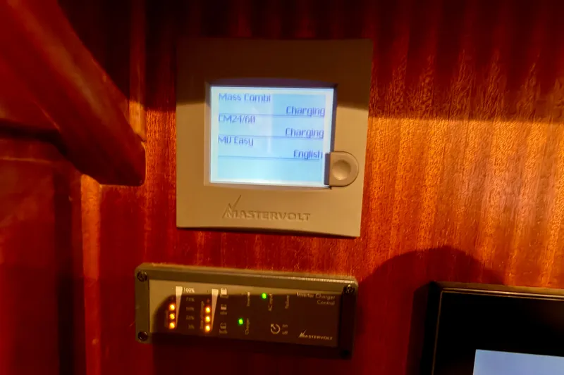 Slide: The Image of Mastervolt control panel on 2016 Nordic Tug 44 yacht, displaying charging status. - 72