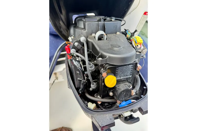 Slide: The Image of Engine compartment of a 2016 Nordic Tug 44, showcasing mechanical components and wiring. - 32