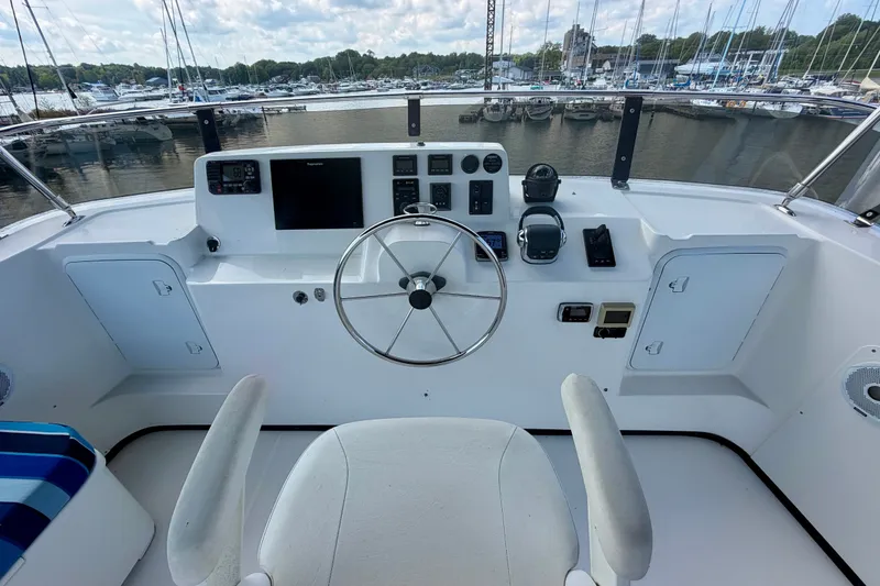 Slide: The Image of Helm of 2016 Nordic Tug 44 with steering wheel and navigation equipment. - 26