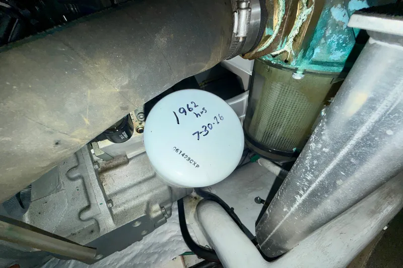 Slide: The Image of Engine compartment of a 2016 Nordic Tug 44 with visible filter and handwritten notes. - 92