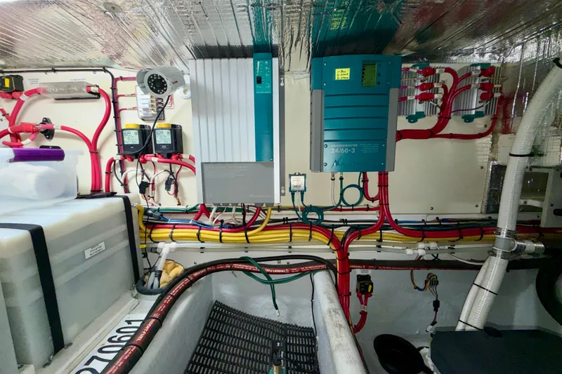 Slide: The Image of Engine room of a 2016 Nordic Tug 44 with electrical systems and wiring. - 103
