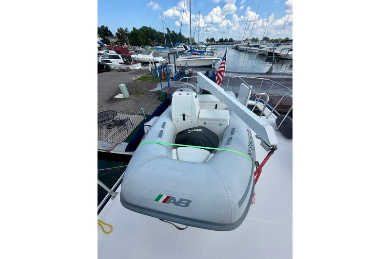 Slide: The Image of Inflatable boat on 2016 Nordic Tug 44, docked at marina with other boats. - 27