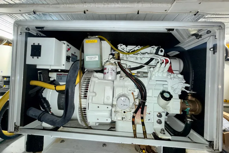 Slide: The Image of Engine compartment of a 2016 Nordic Tug 44, showcasing generator and wiring. - 97