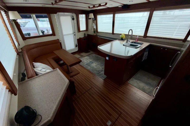 Slide: The Image of Interior of a 2016 Nordic Tug 44 with kitchen and seating area. - 42