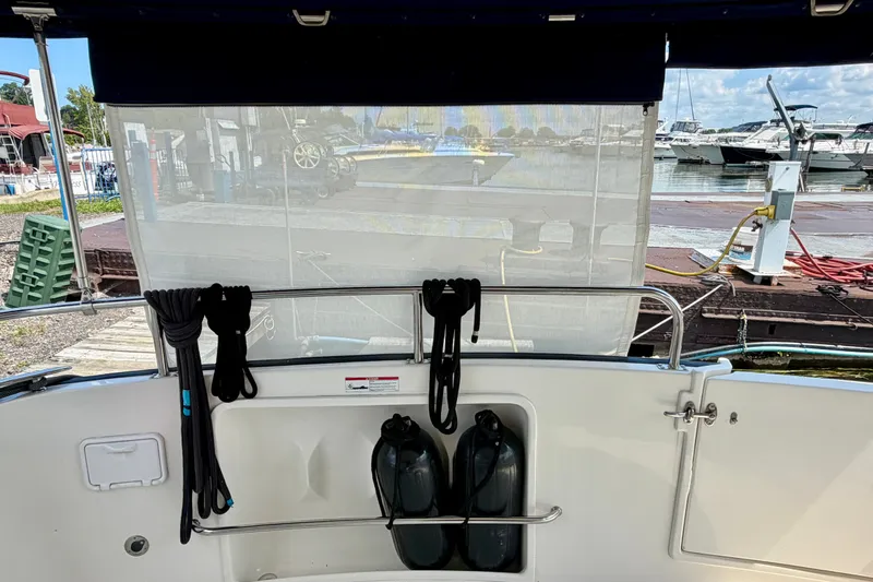 Slide: The Image of Nordic Tug 44 (2016) boat deck with ropes and fenders at a marina. - 20