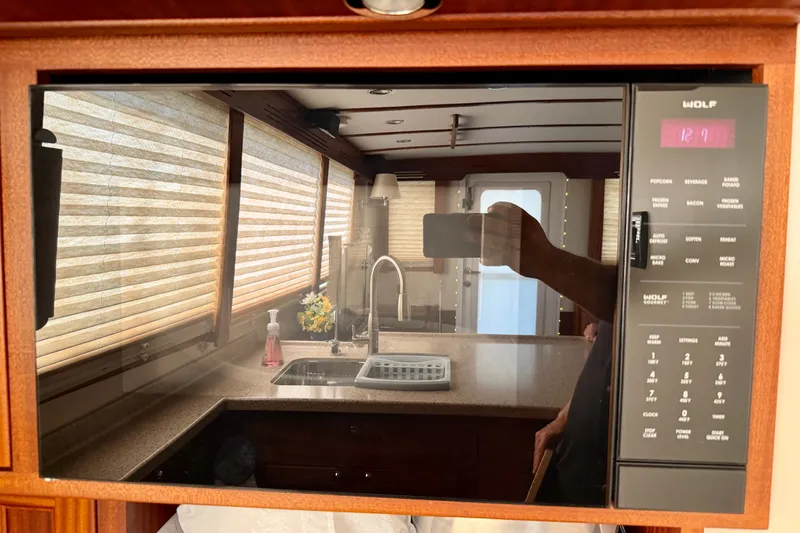 Slide: The Image of Interior of 2016 Nordic Tug 44 with kitchen reflection in microwave. - 39