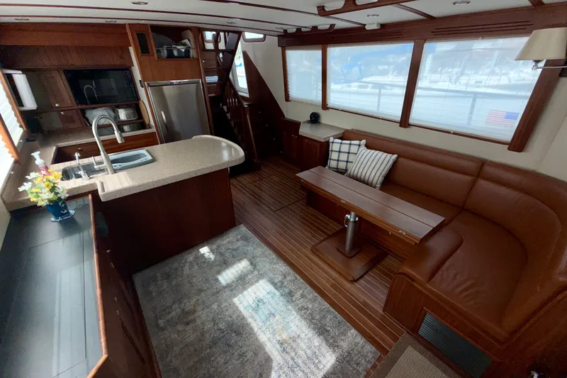 Slide: The Image of Interior of a 2016 Nordic Tug 44 with modern kitchen and cozy seating area. - 34