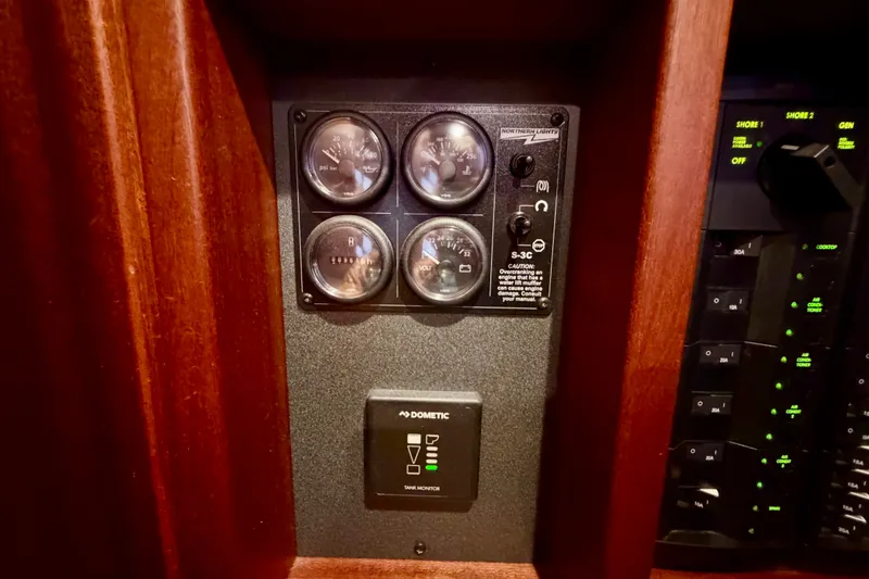 Slide: The Image of Control panel of a 2016 Nordic Tug 44 boat with gauges and switches. - 69