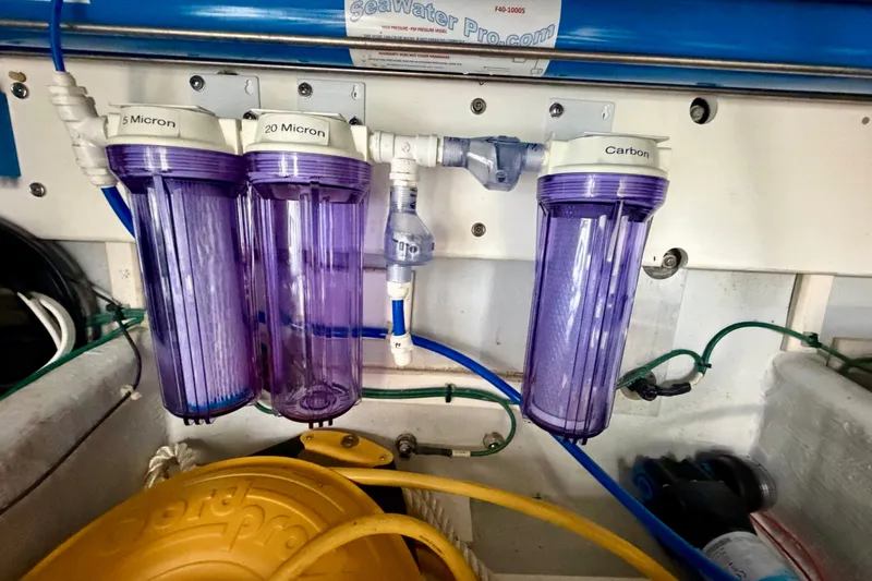 Slide: The Image of Water filtration system on a 2016 Nordic Tug 44 boat, featuring 5, 20 micron, and carbon filters. - 106