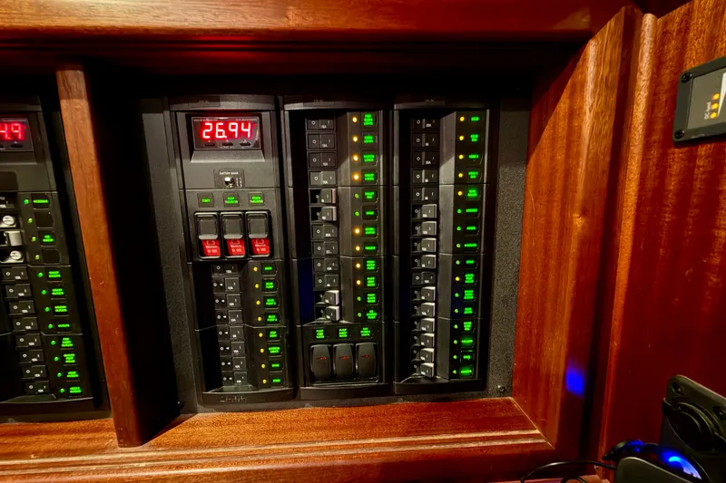 Slide: The Image of Electrical panel of a 2016 Nordic Tug 44 with digital display and switches. - 71