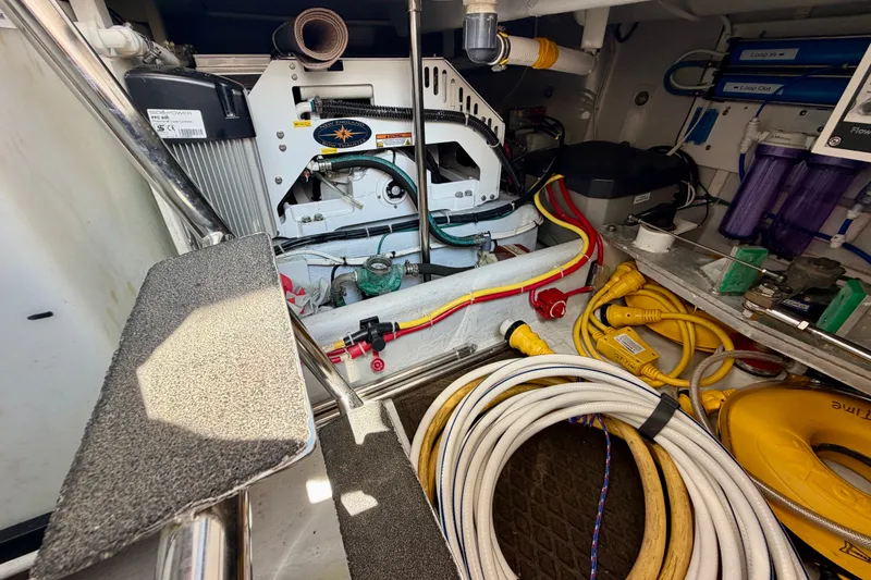 Slide: The Image of Engine room of a 2016 Nordic Tug 44 with cables and equipment. - 110