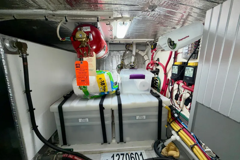 Slide: The Image of Engine room of a 2016 Nordic Tug 44 with equipment and wiring. - 91