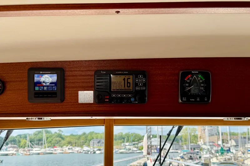 Slide: The Image of Control panel of a 2016 Nordic Tug 44 with navigation instruments. - 66