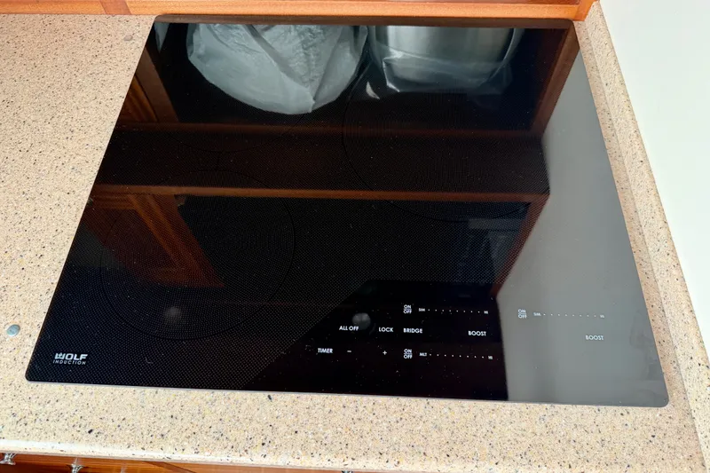 Slide: The Image of Wolf induction cooktop on a Nordic Tug 44, 2016 model, with touch controls. - 38