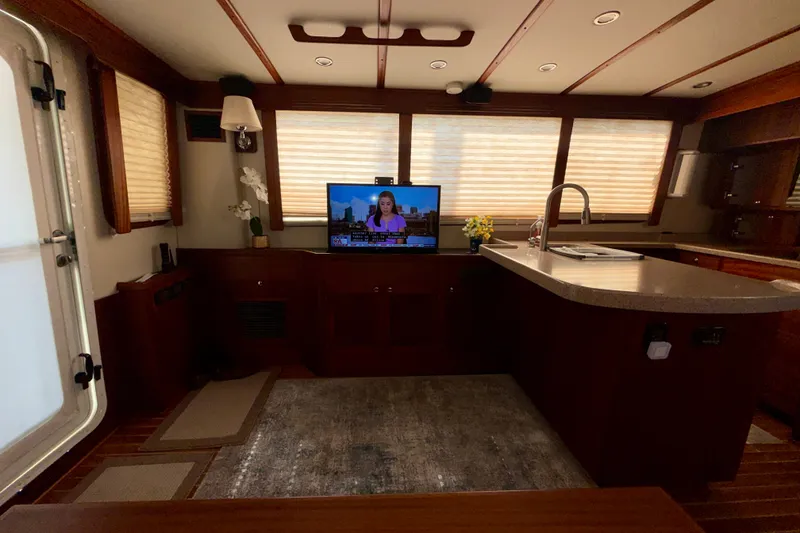 Slide: The Image of Interior of a 2016 Nordic Tug 44 with a cozy living area and modern kitchen. - 36