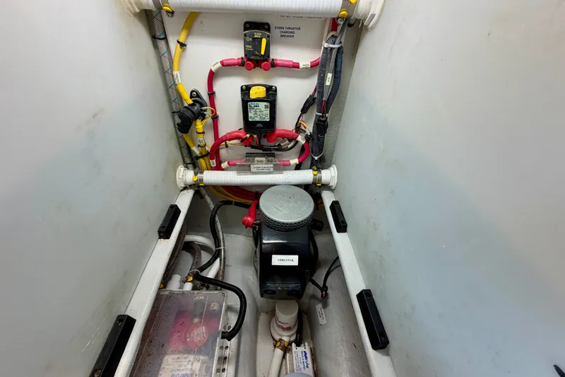 Slide: The Image of Engine compartment of a 2016 Nordic Tug 44 with electrical components and wiring. - 114