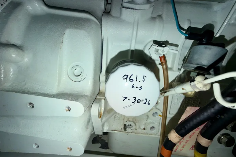Slide: The Image of Engine compartment of a 2016 Nordic Tug 44 with maintenance details on filter. - 99