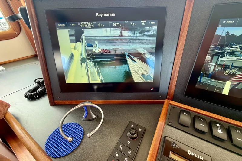 Slide: The Image of Raymarine display on 2016 Nordic Tug 44 showing dock view and controls. - 59