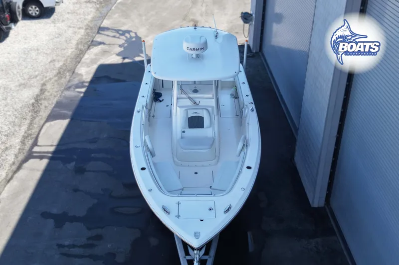 Slide: The Image of 2023 Cobia 262 Center Console boat in a marina setting, top view. - 3