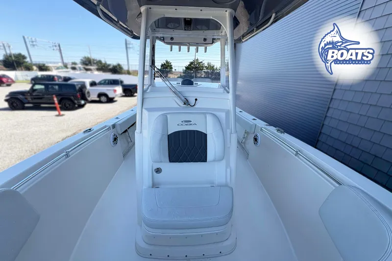 Slide: The Image of 2023 Cobia 262 Center Console boat interior with seating and logo. - 6