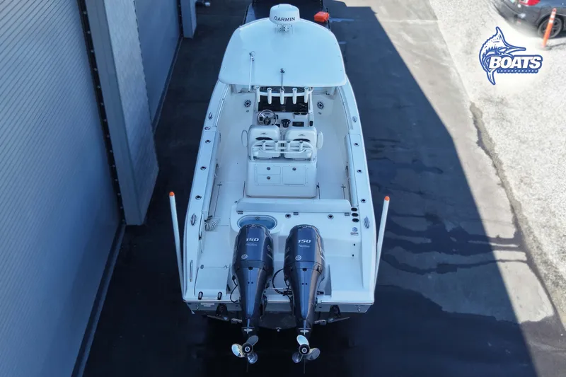 Slide: The Image of 2023 Cobia 262 Center Console boat with dual outboard engines, viewed from above. - 14